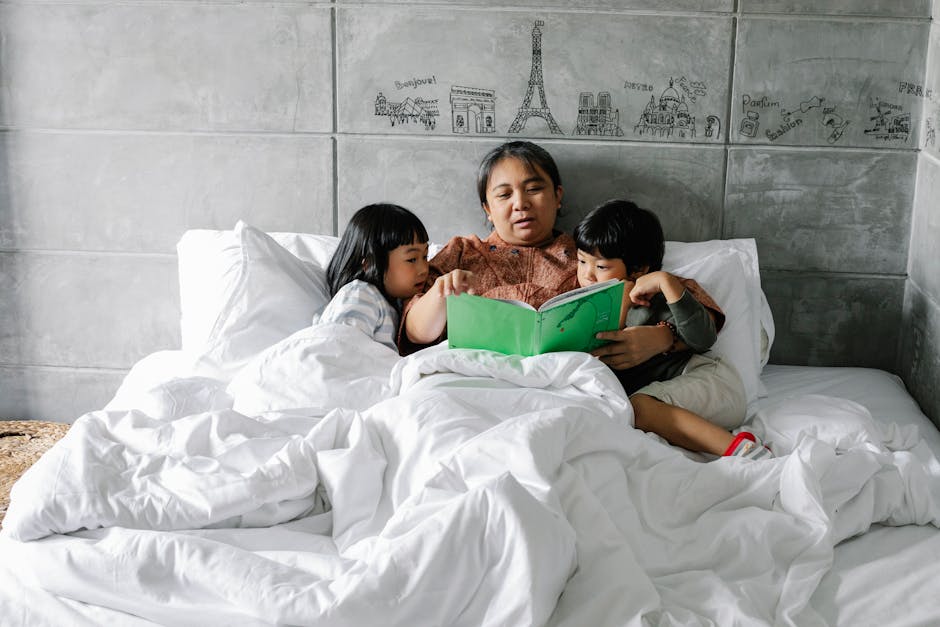 A grandmother reads a storybook to her grandchildren, creating a cozy moment in a bedroom.