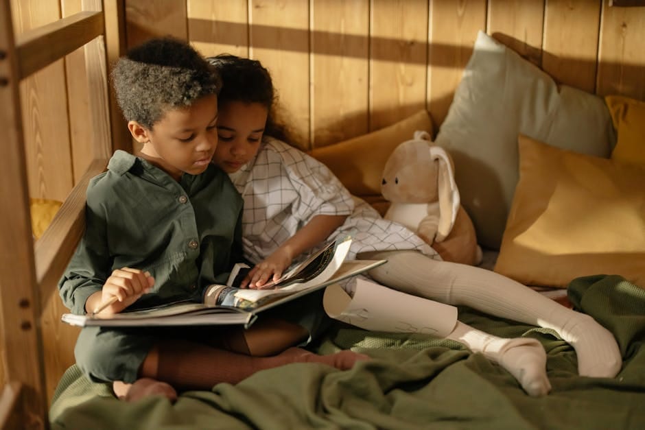 Two children reading together in a cozy room, capturing sibling love and togetherness.