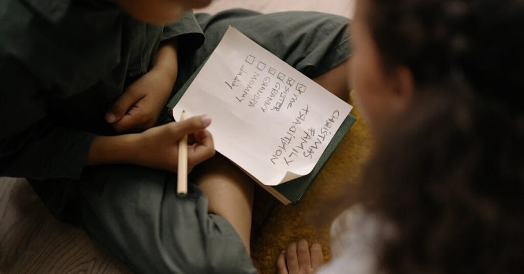 Family enjoying a cozy indoor moment, creating a checklist together with focused energy.