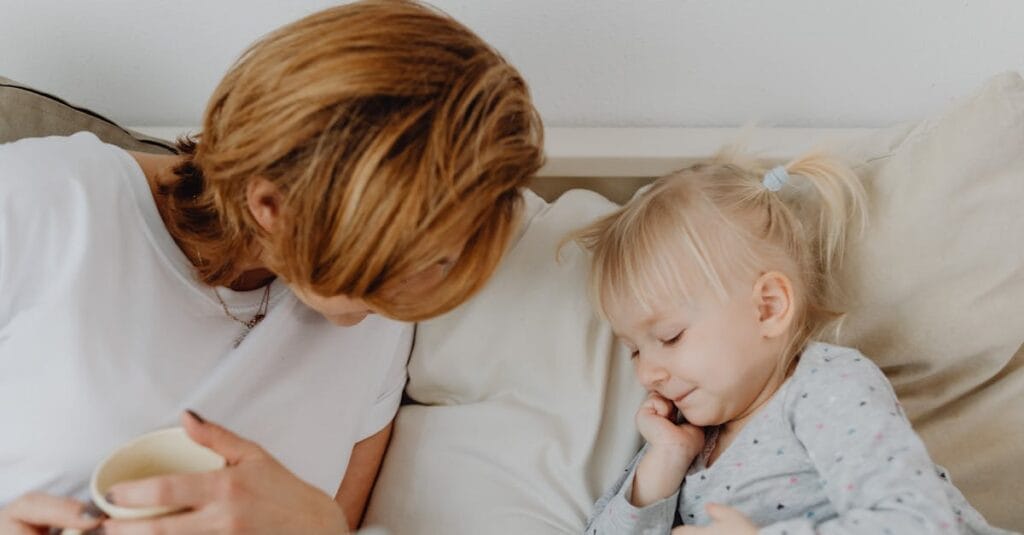 Mother and child bonding on a cozy bed, sharing a comforting and relaxing moment.