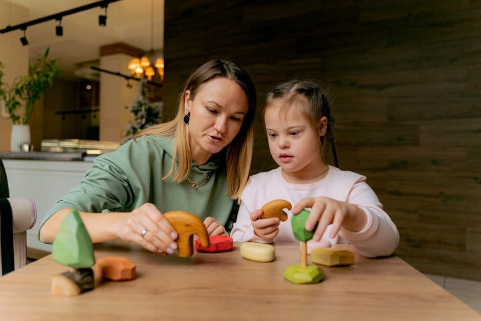 A mother and daughter engaging in play with wooden toys at a table indoors.