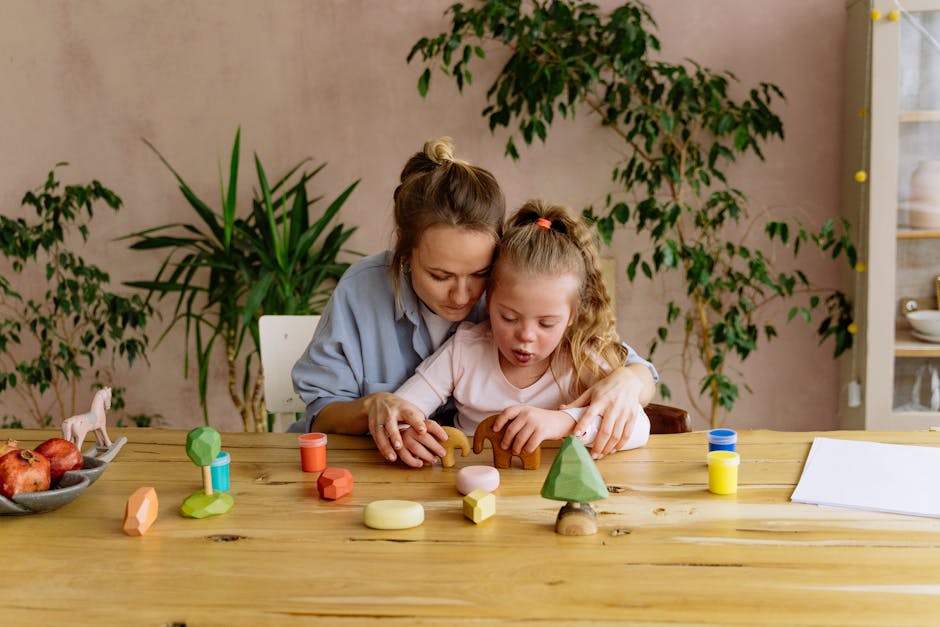 A mother and daughter enjoying creative playtime with wooden toys at the table indoors.