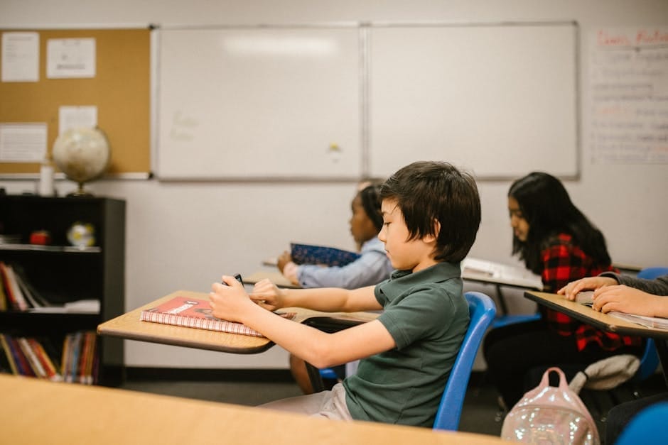 Students attentively learning in a diverse classroom setting, capturing modern education dynamics.