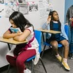 A diverse group of students in a classroom highlighting bullying awareness.