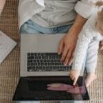 Father and child bonding over a laptop, enjoying togetherness and learning.