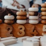 Close-up of wooden number stacking toy promoting creativity and learning in children.