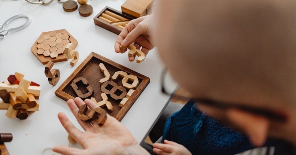 Adults and children playing with intricate wooden puzzles on a white table, fostering creativity.