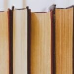 Close-up view of vintage book bindings in a library setting.