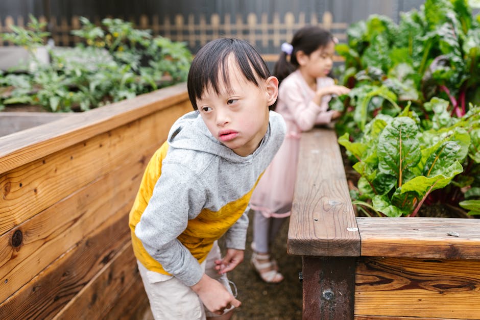 Children with Down syndrome enjoying a garden experience.