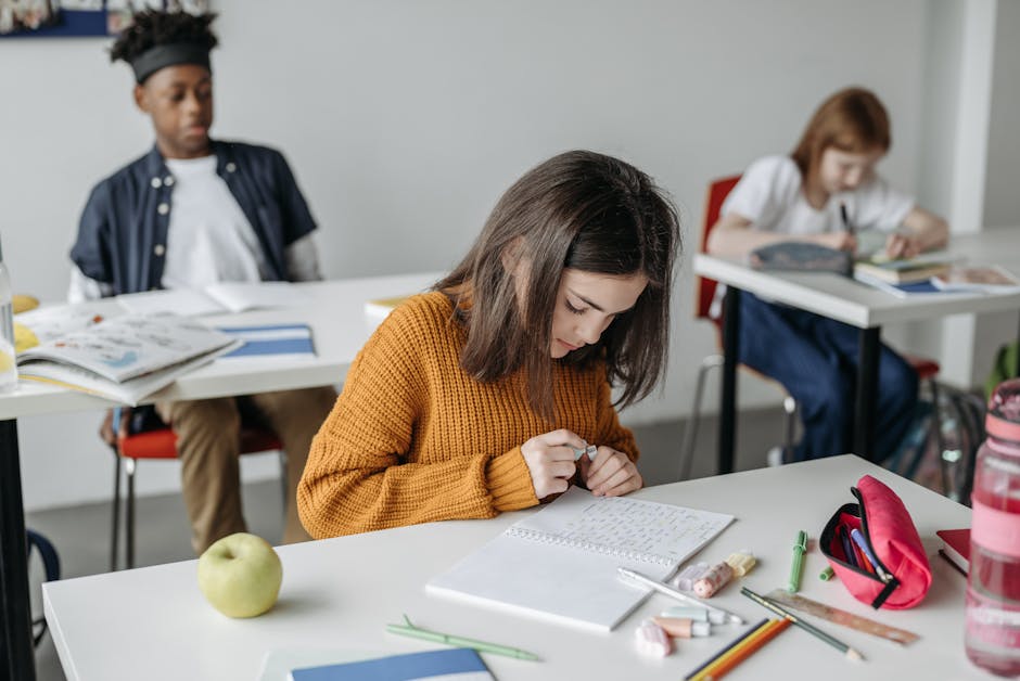 Children engaged in learning activities in a modern classroom setting, enhancing education focus.