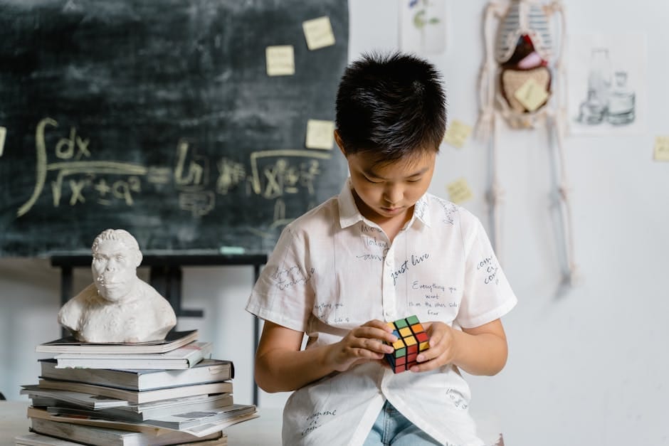 A child focuses on solving a Rubik's cube in an academic setting, reflecting intelligence and concentration.