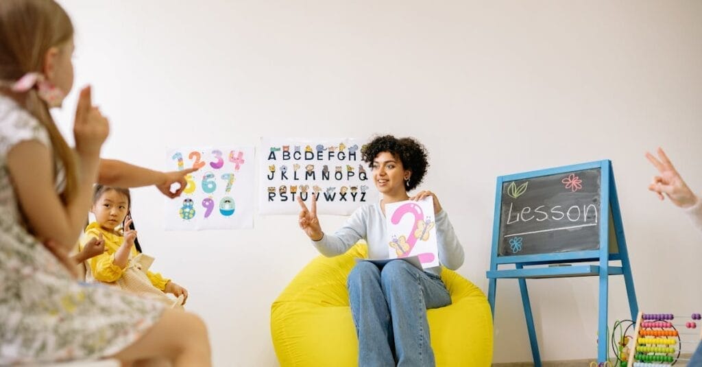 Teacher engaging young students in a fun and educational preschool setting.