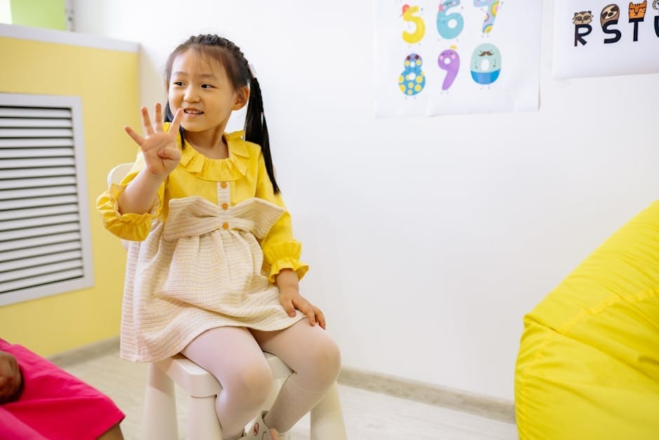 Young girl in a classroom setting learning numbers, showcasing educational activities.