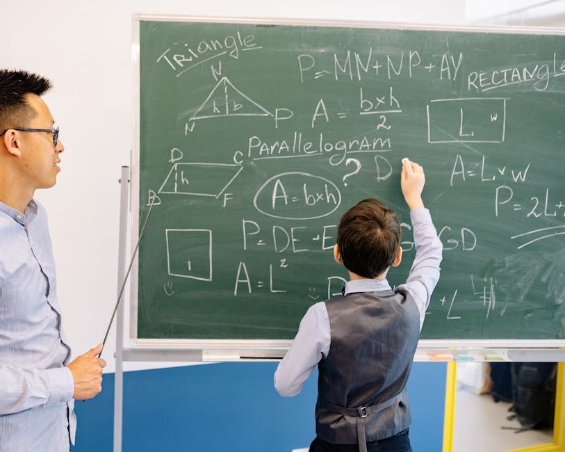 Teacher and student engage in a geometry lesson, solving problems on the chalkboard.