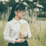 asian, nature, student, book, child, girl, uniform, school uniform, eyeglasses, field, grass, kid, looking away, outdoors, portrait, student, student, student, student, student