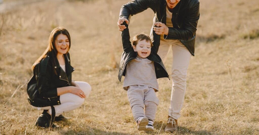 Family enjoying playful soccer game outdoors, capturing joyful moments.