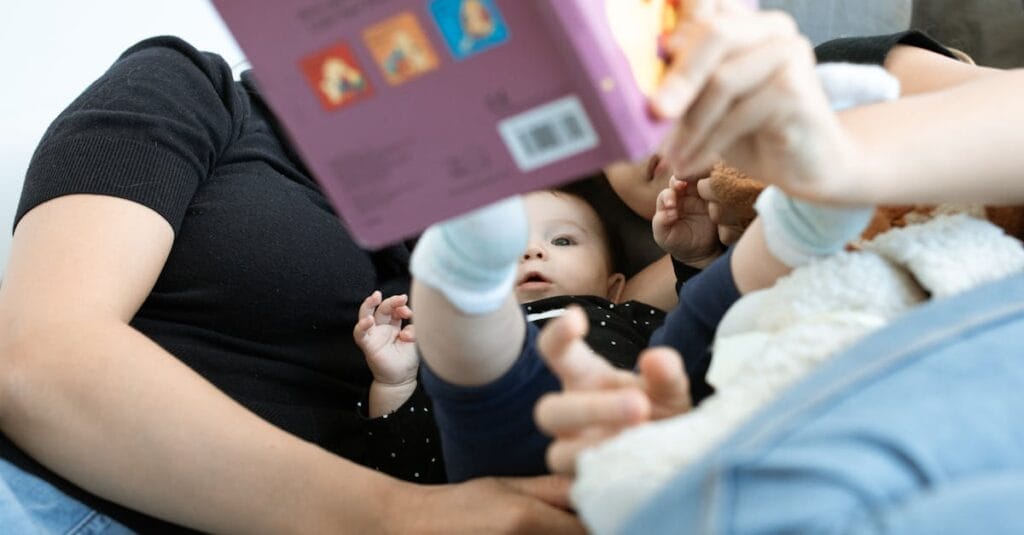 A baby and family reading together, promoting love and education. Cozy indoors setting.