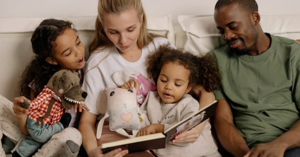 A diverse family enjoys reading a storybook together, fostering warmth and connection.